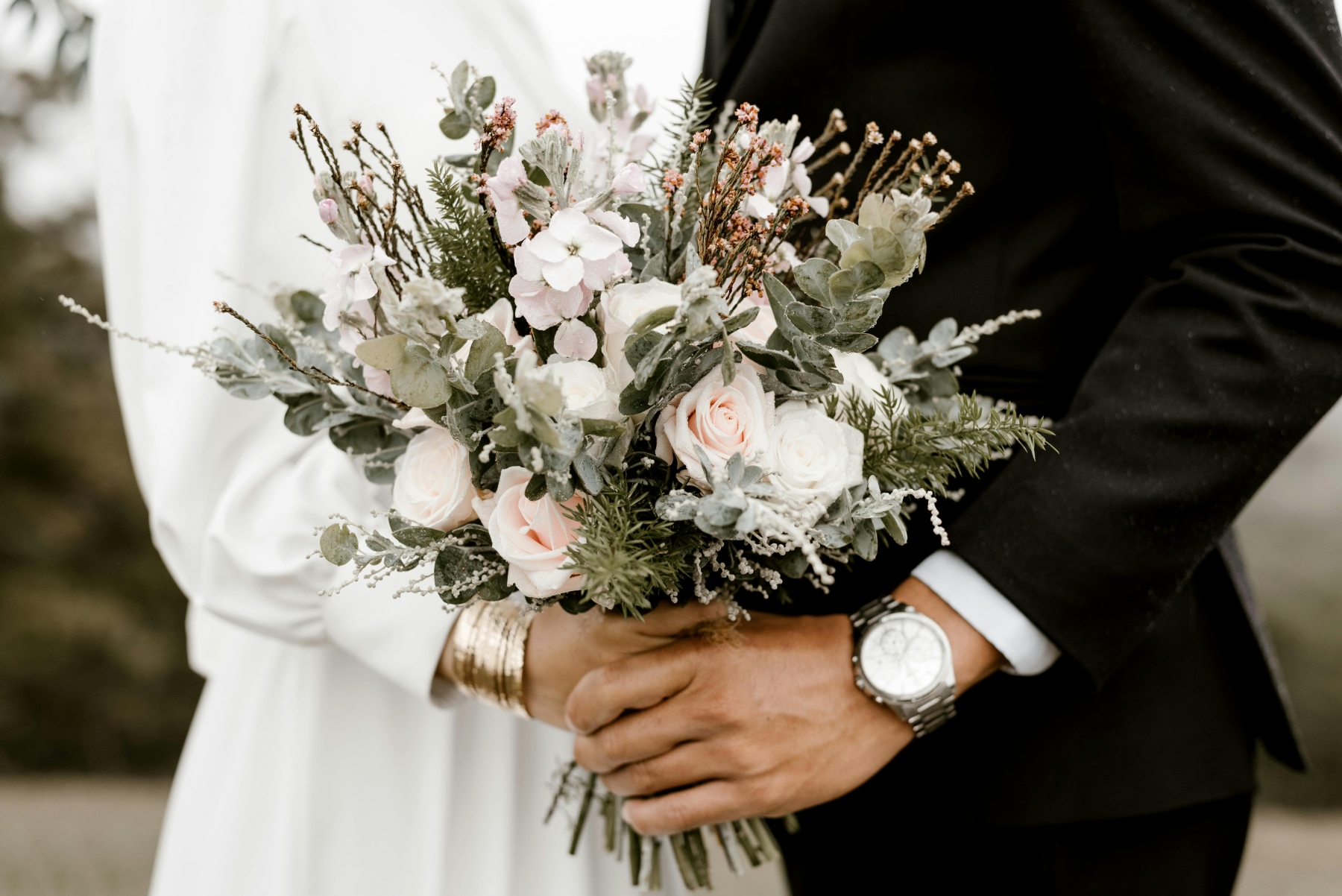 bride groom holding bouquet